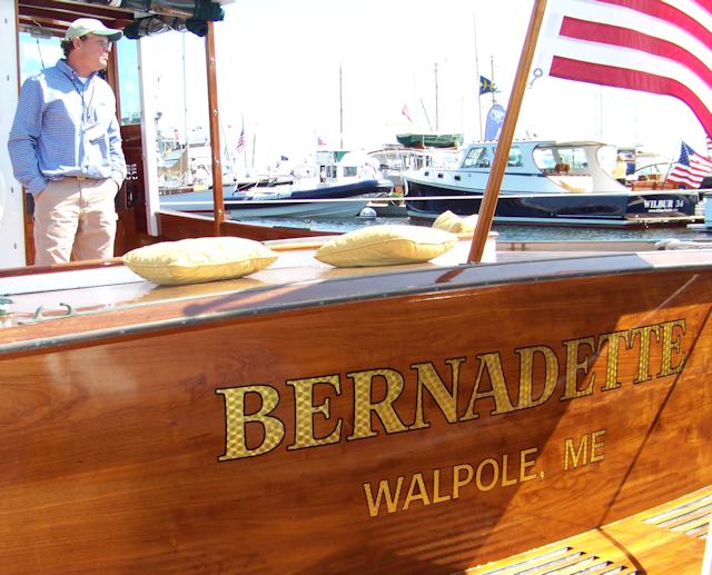 Engine turned gold name Burnadette with builder Pete Kass of John's Bay Boat.