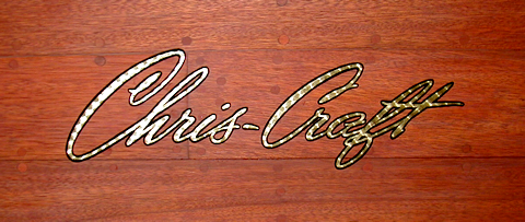 engine turned gold Chris-Craft logo