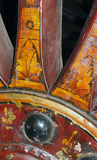 Roman Urn on front corner of hand engine.
