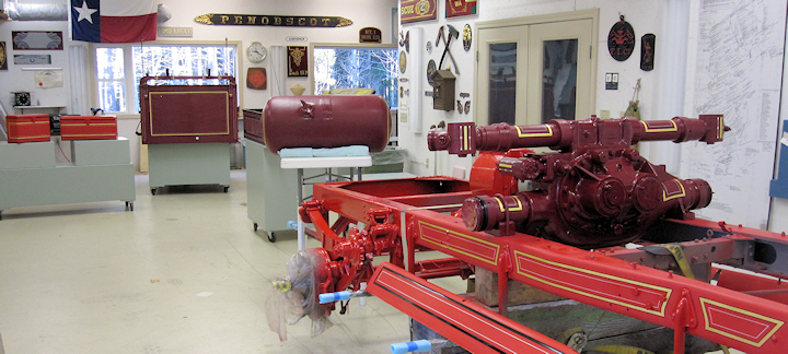Fire Gold shop interior with American LaFrance frame and pump.