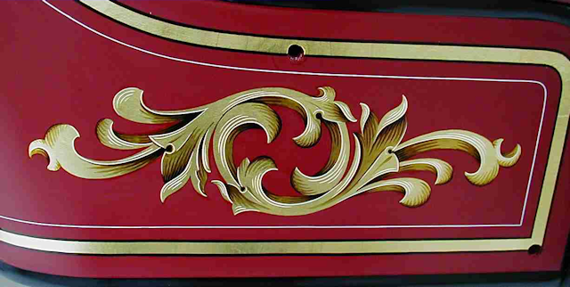 Hand painted Ahrens-Fox seat scroll by Peter Achorn.